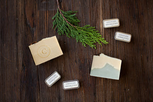Handmade Holiday Soap Bar and a lip salve packaged in a festive muslim bag with ribbon