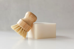 Natural Sisal Dishwashing bamboo brush pictured with solid dishwashing soap bar
