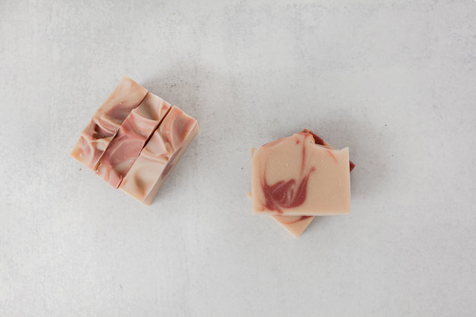 Wintermint coconut milk soap bar colored with pink rose clay and madder root powder.